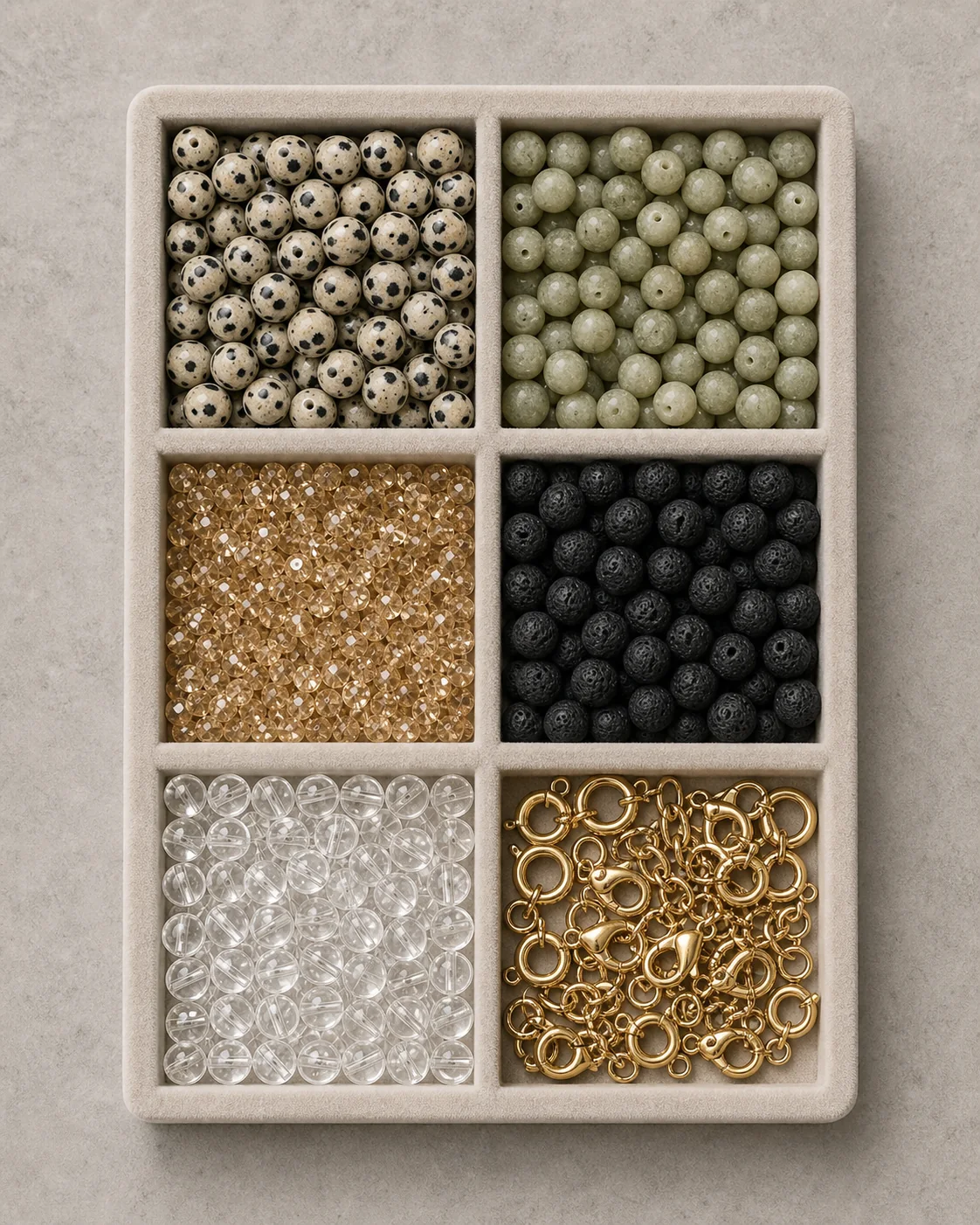 Sample tray with six compartments of beads and findings